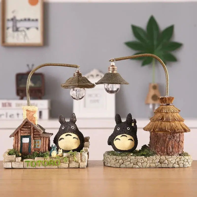 Totoro LED desk lamp set by Simples Market with two bulbs, two Totoro figures, cottages, and stone base decor.
