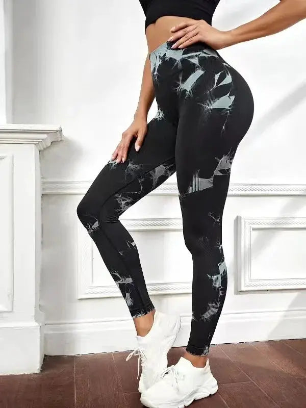 Women's tie-dye nine-tenths leggings by Simples Market; high-waist, stretchy black yoga pants with blue-gray pattern.