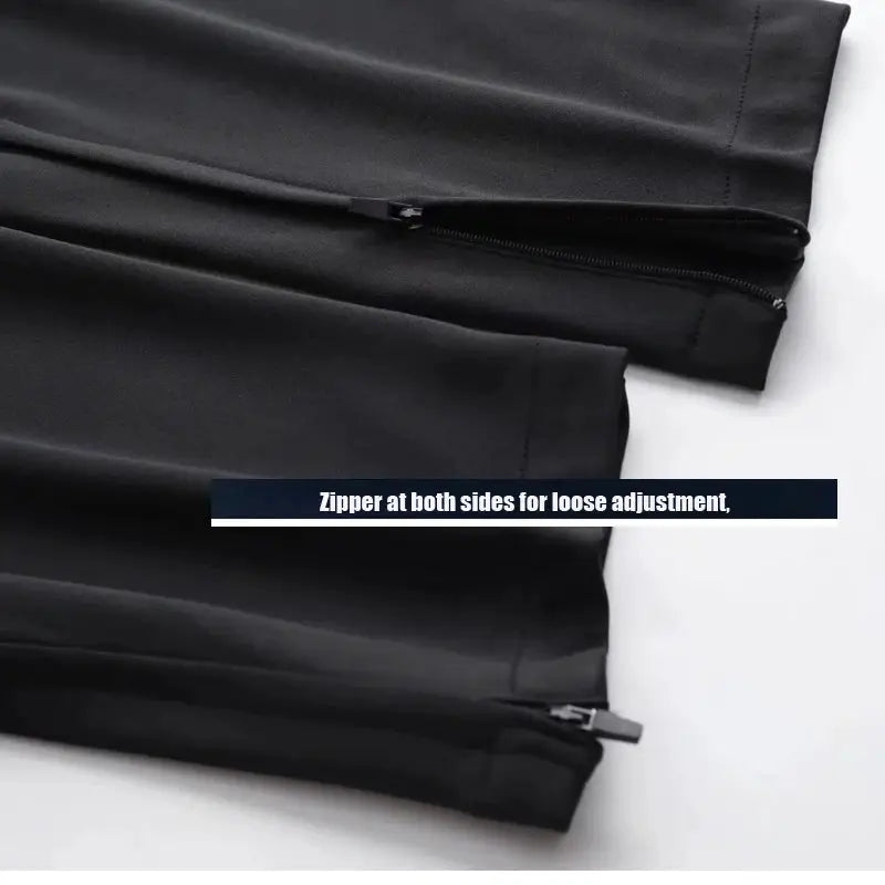 Men's sport pants by Simples Market, black athletic joggers with zip pockets and side zippers.