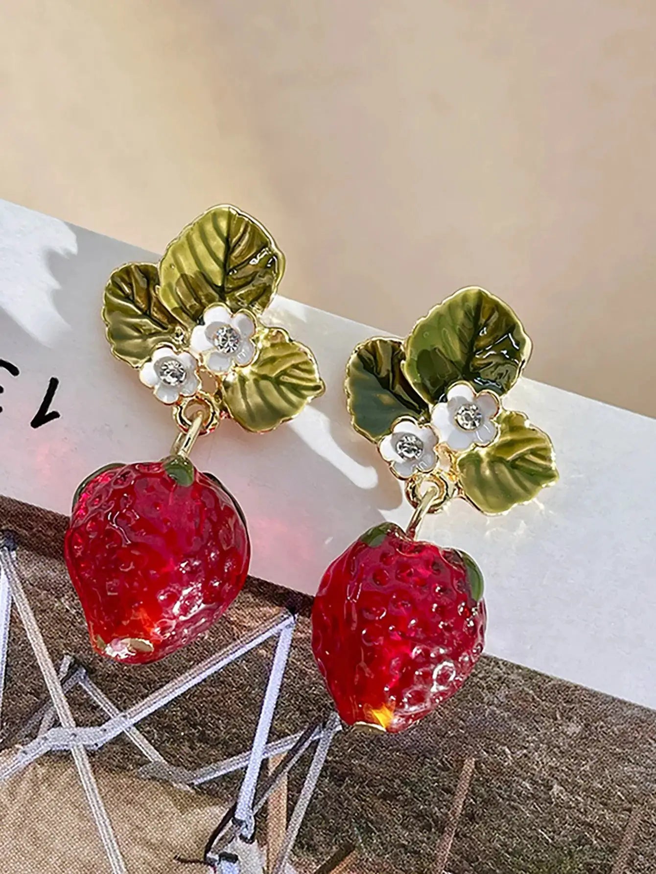 Simples Market strawberry drop earrings with red strawberry charms, green enamel leaves and white flowers