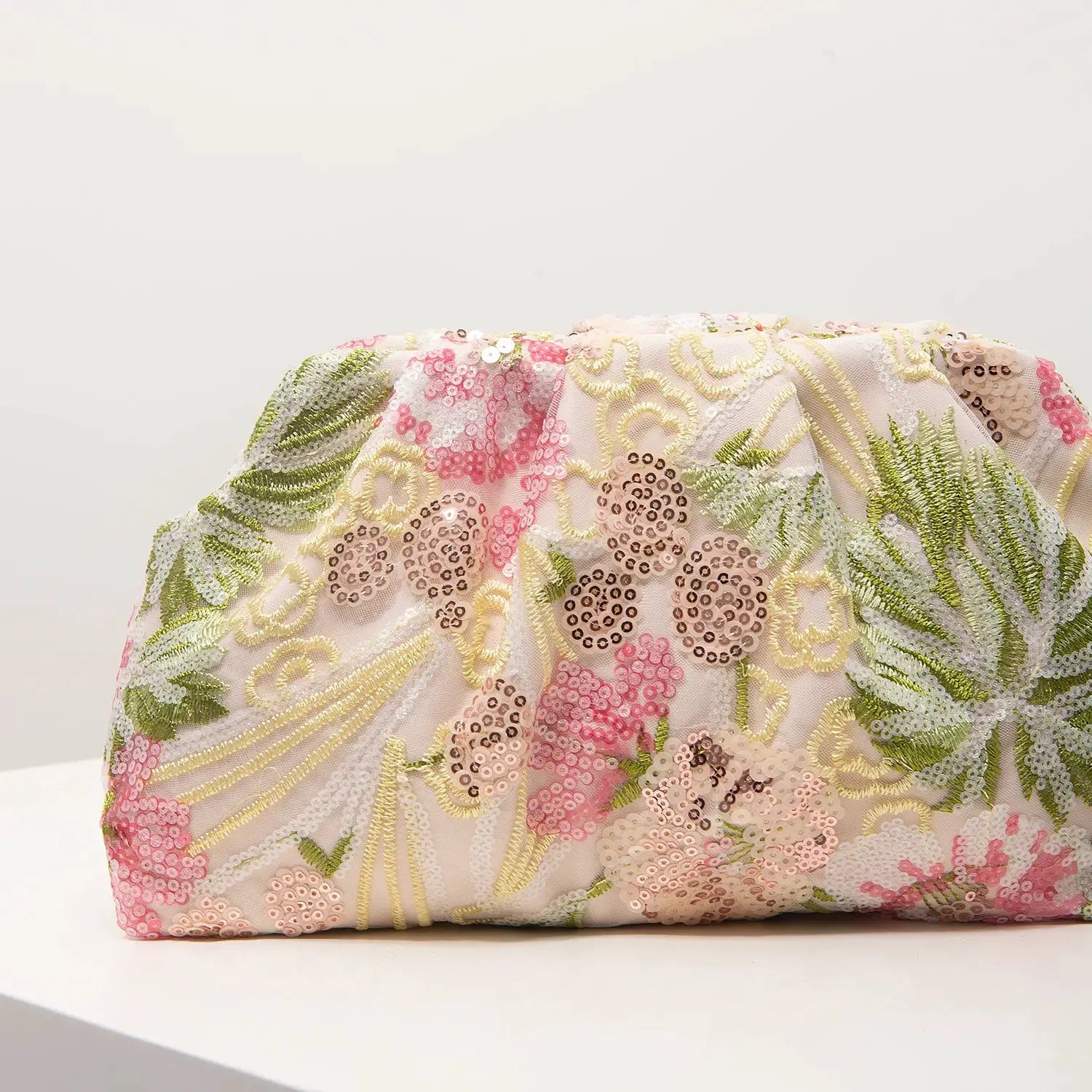 Clutch bag in pastel pink with sequin floral embroidery and gold detailing