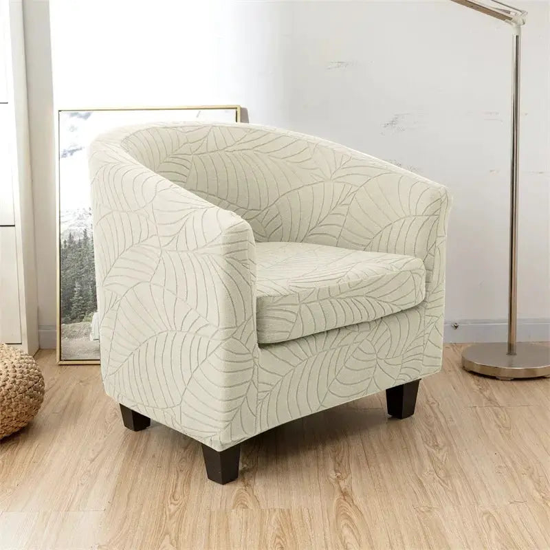 Leaves Jacquard tub chair cover in cream with leaf pattern; stretch slipcover by Simples Market for a single armchair.
