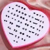 Resin stud earrings set in a pink heart box; 36-pair assortment of snowflakes, cats, and butterflies