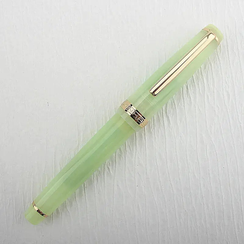 Jinhao 82 fountain pen in green acrylic with gold trim and clip