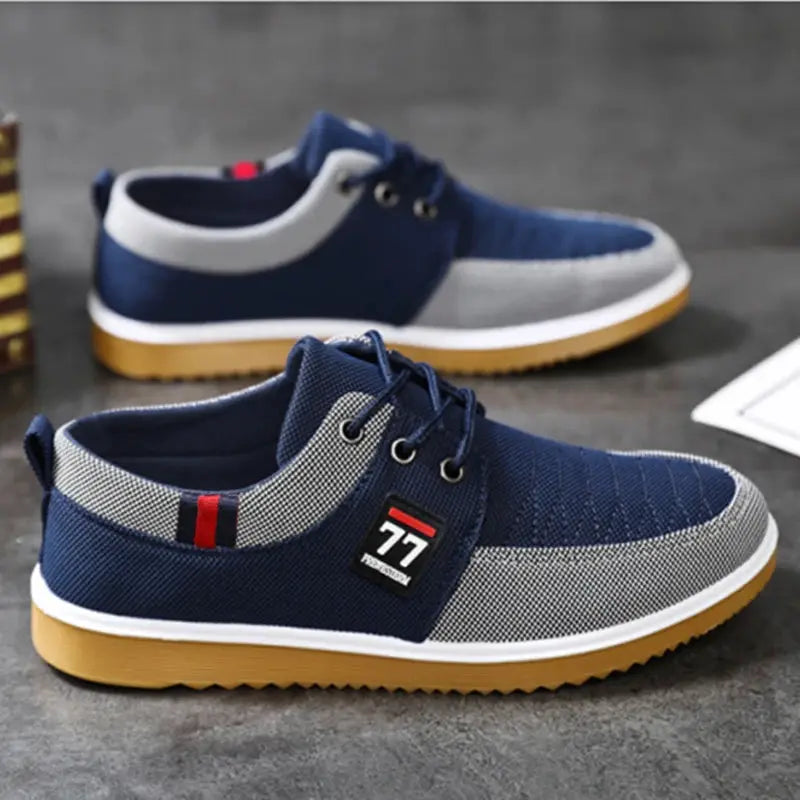 Men's knitted casual sports shoes, navy and grey with white midsole and gum outsole, 2 pairs shown.