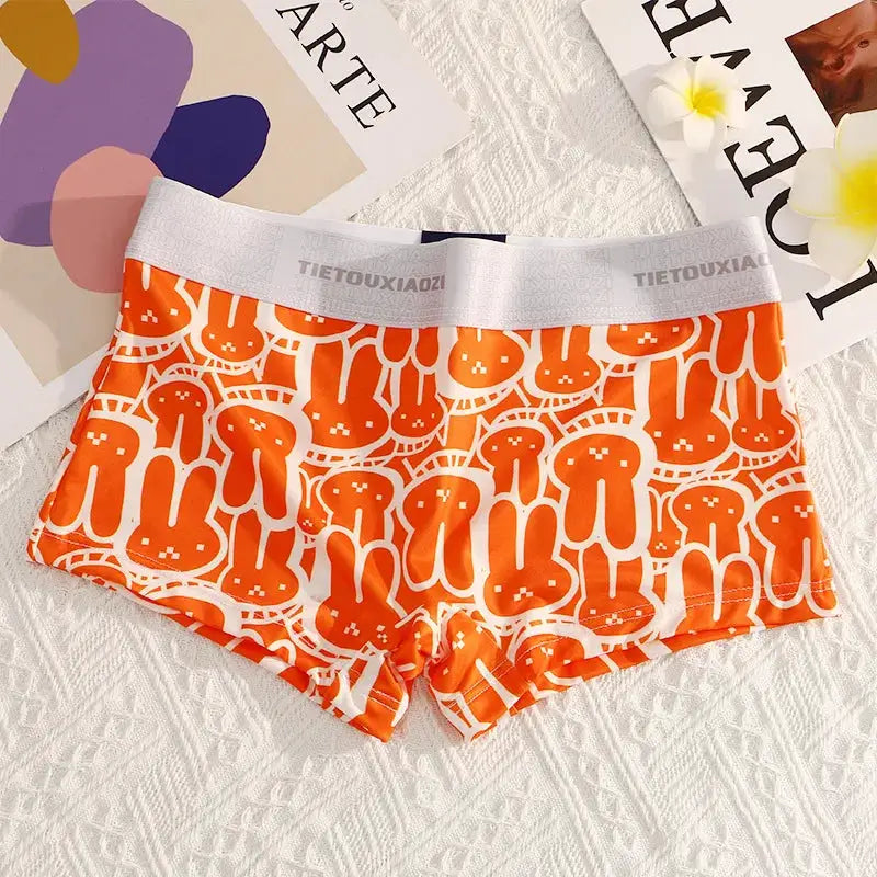 Women's orange seamless boyshort underwear with white elastic waistband, breathable fabric