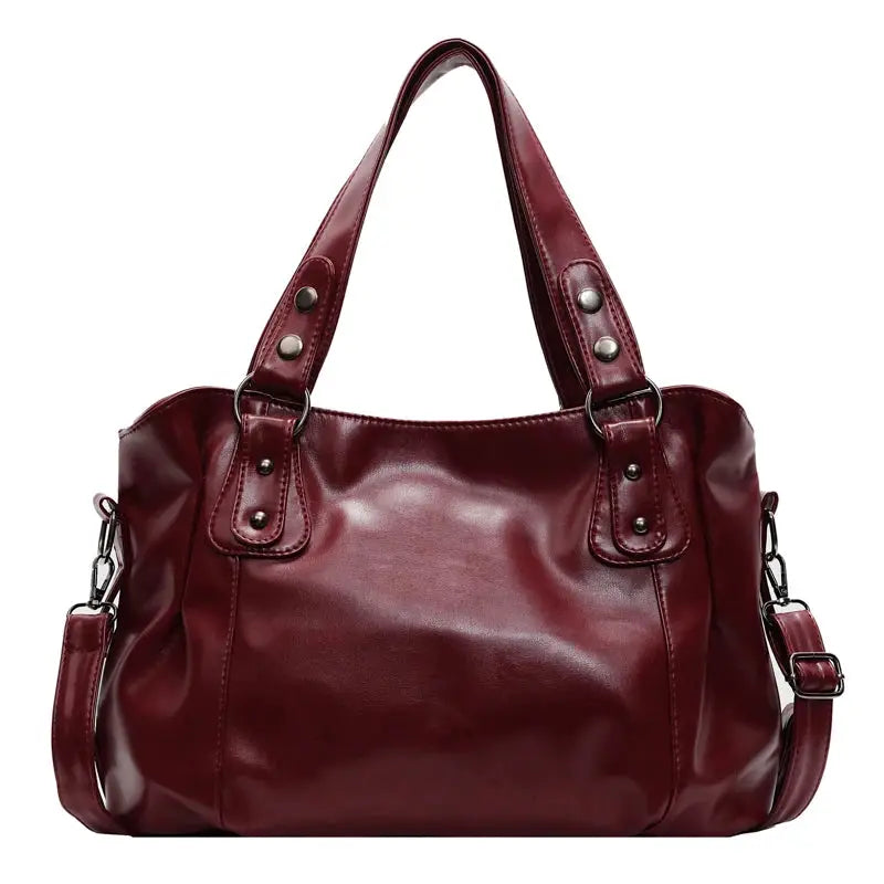 Roomy shoulder bag by Simples Market in burgundy soft PU leather with large capacity.