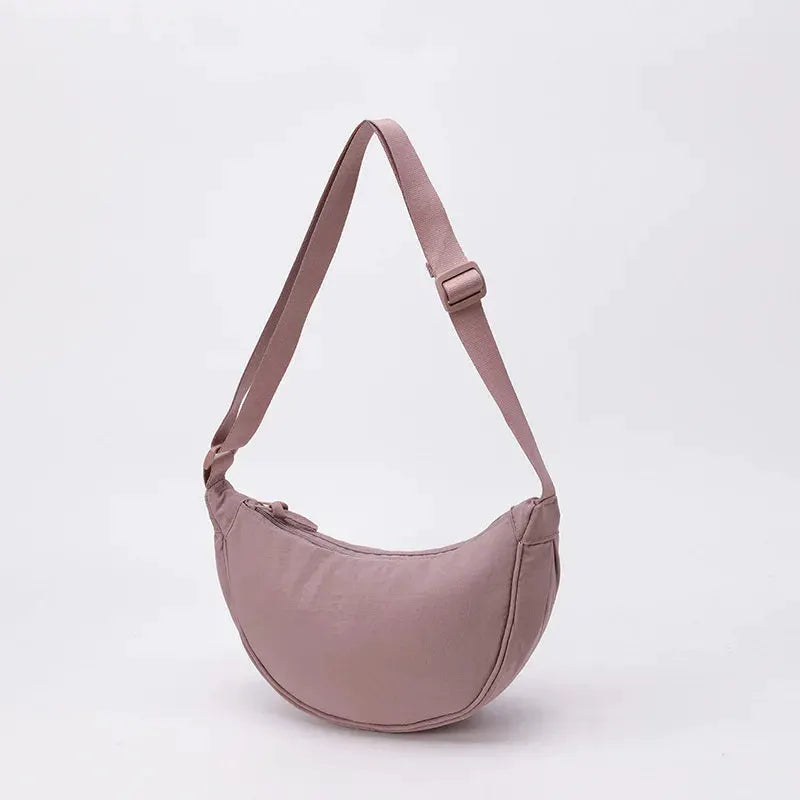 Nylon crossbody bag, Simples Market, crescent dumpling shape in dusty pink, large capacity, adjustable strap.