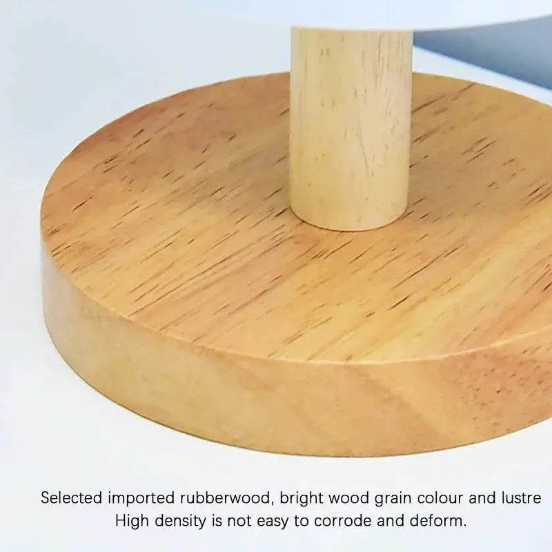 LED table lamp by Simples Market on round rubberwood base with central wooden stem and wood grain finish