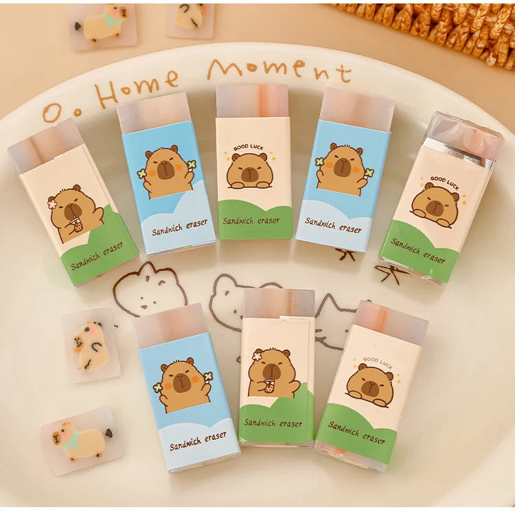 Capybara sandwich erasers set by Simples Market; 9 pastel cartoon erasers in blue and green packaging