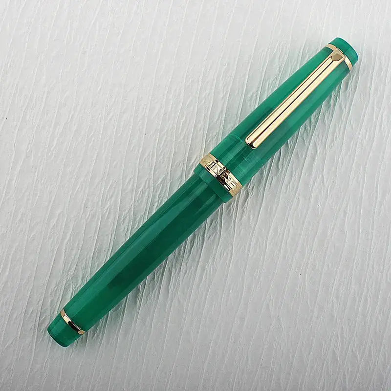 Jinhao 82 green acrylic fountain pen with gold trim and clip, converter included