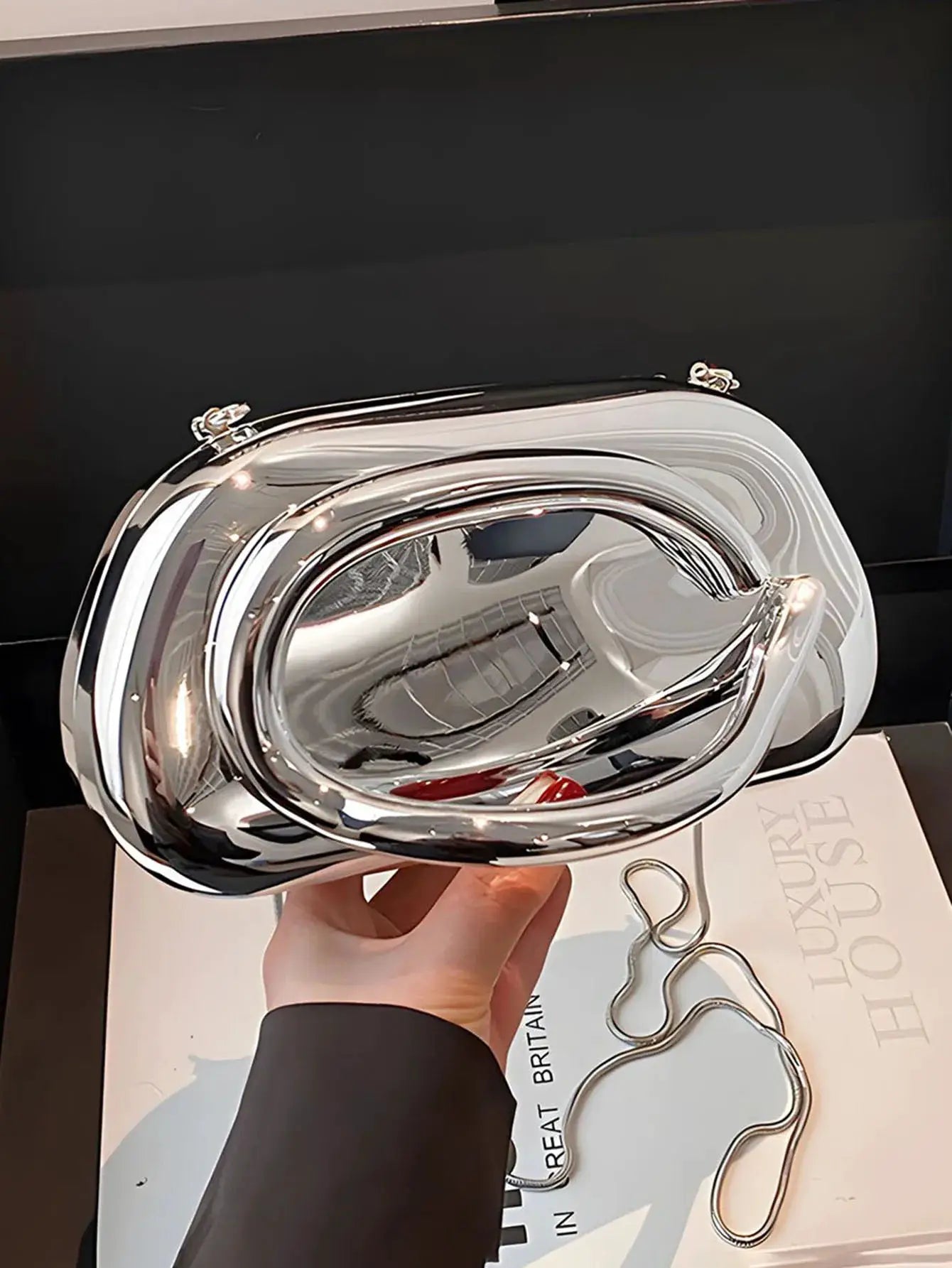 Acrylic box-shaped crossbody bag in metallic silver with a chain strap