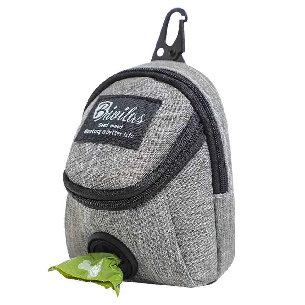 Dog treat pouch in grey fabric with built-in poop bag dispenser and clip for outdoor training