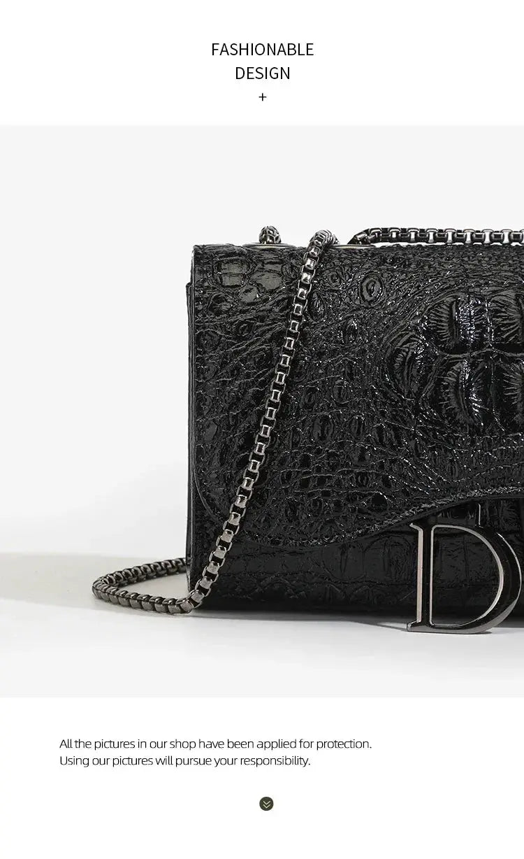 Women's luxury crossbody handbag in black crocodile-embossed leather with metal chain strap