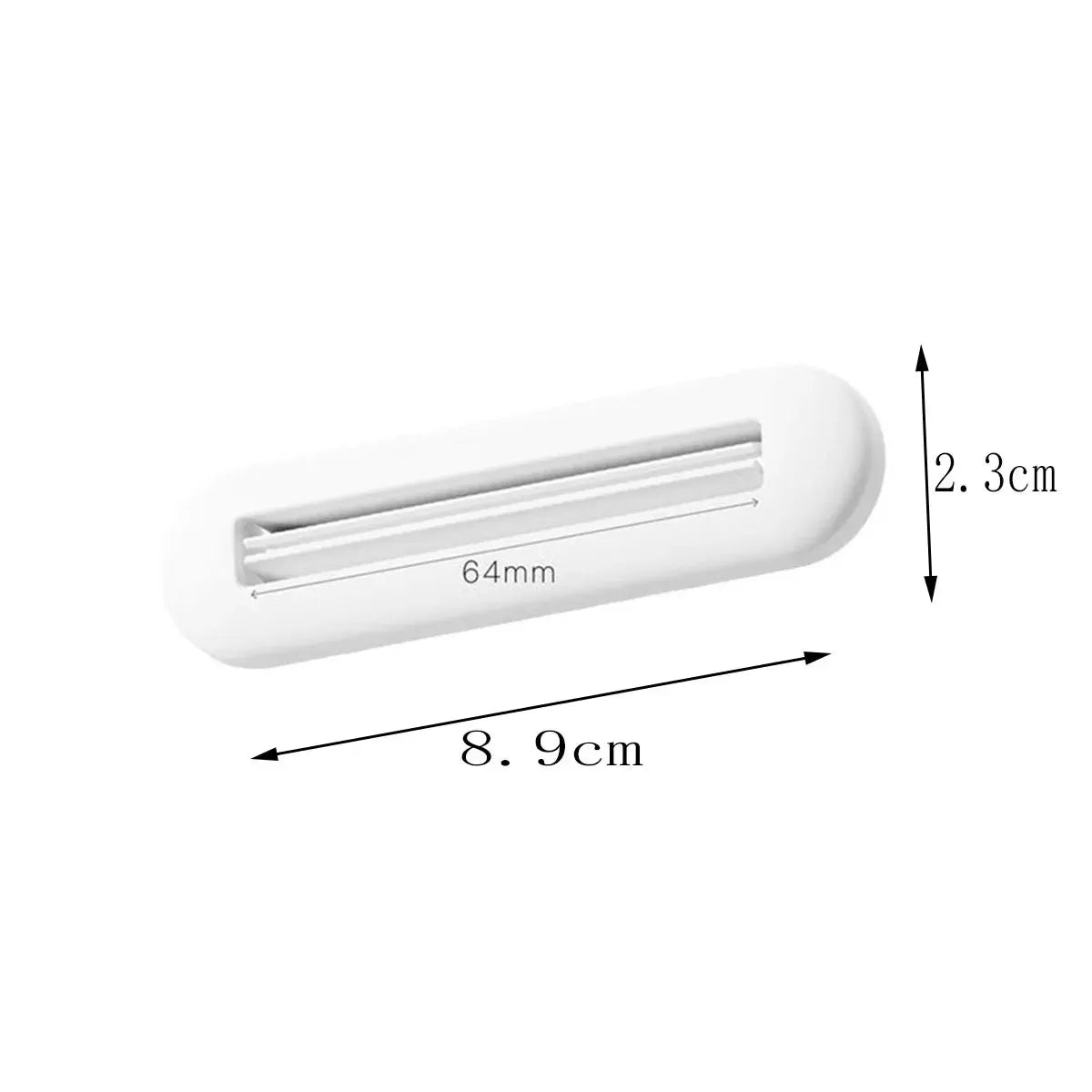 Toothpaste squeezer by Simples Market, white plastic rolling clip, 8.9 cm long.