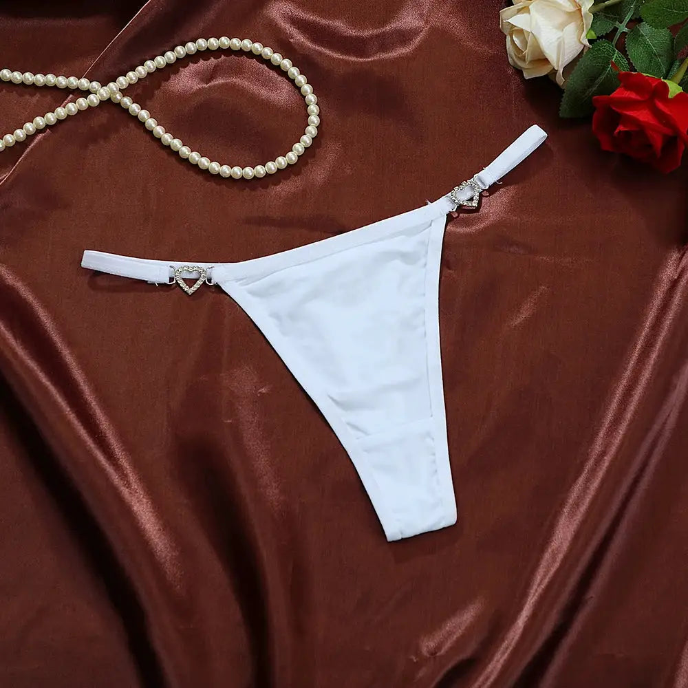 Simples Market white cotton thong with low rise and heart-shaped rhinestone charms on each hip strap