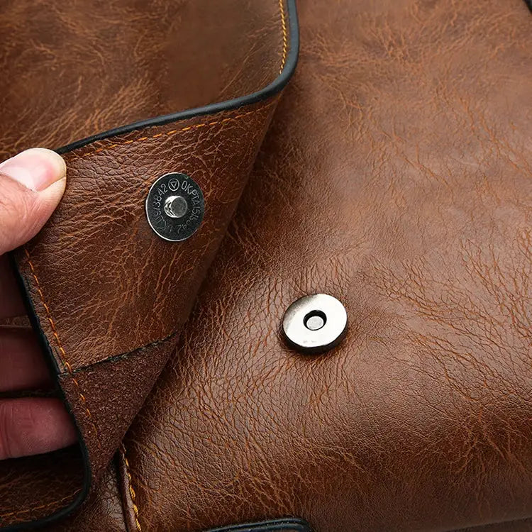 Men's brown leather shoulder bag with magnetic snap closure for business and travel