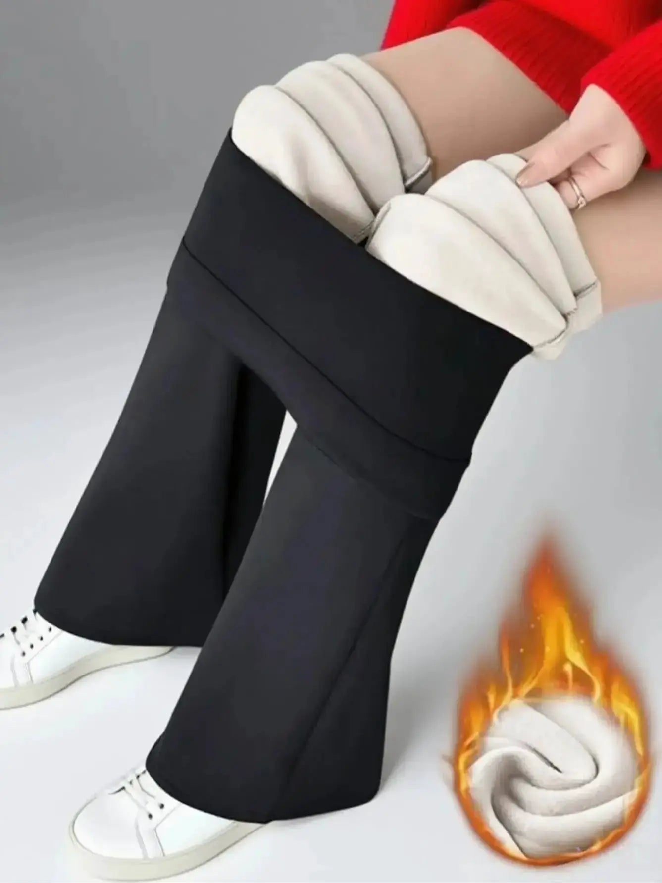Women’s black wool-lined bell-bottom pants with white plush lining at cuffs.