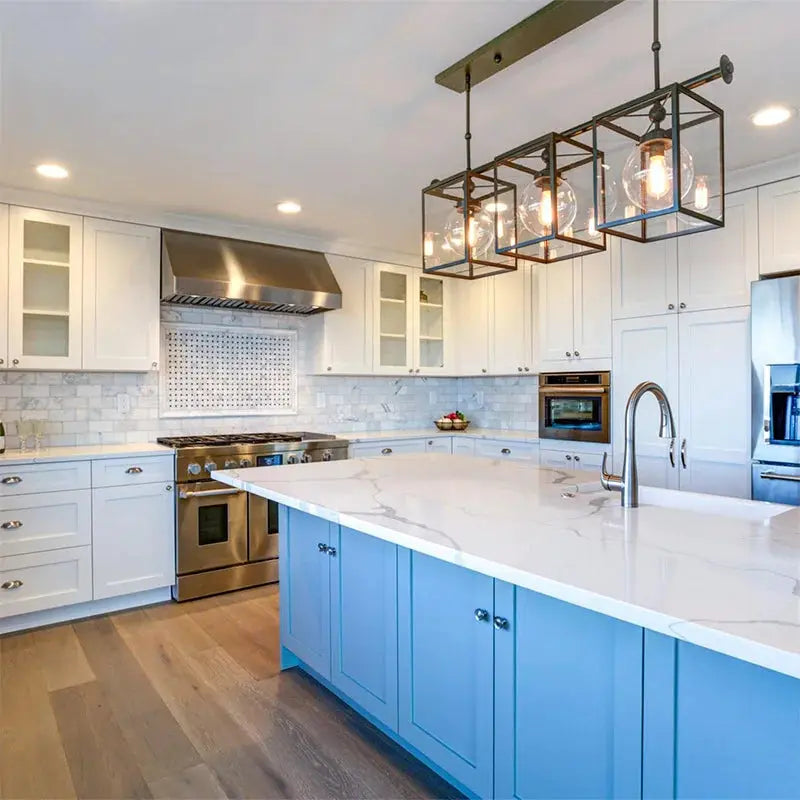 Retro Edison 4-light industrial pendant fixture with black metal cube frames and clear bulbs over a white kitchen island