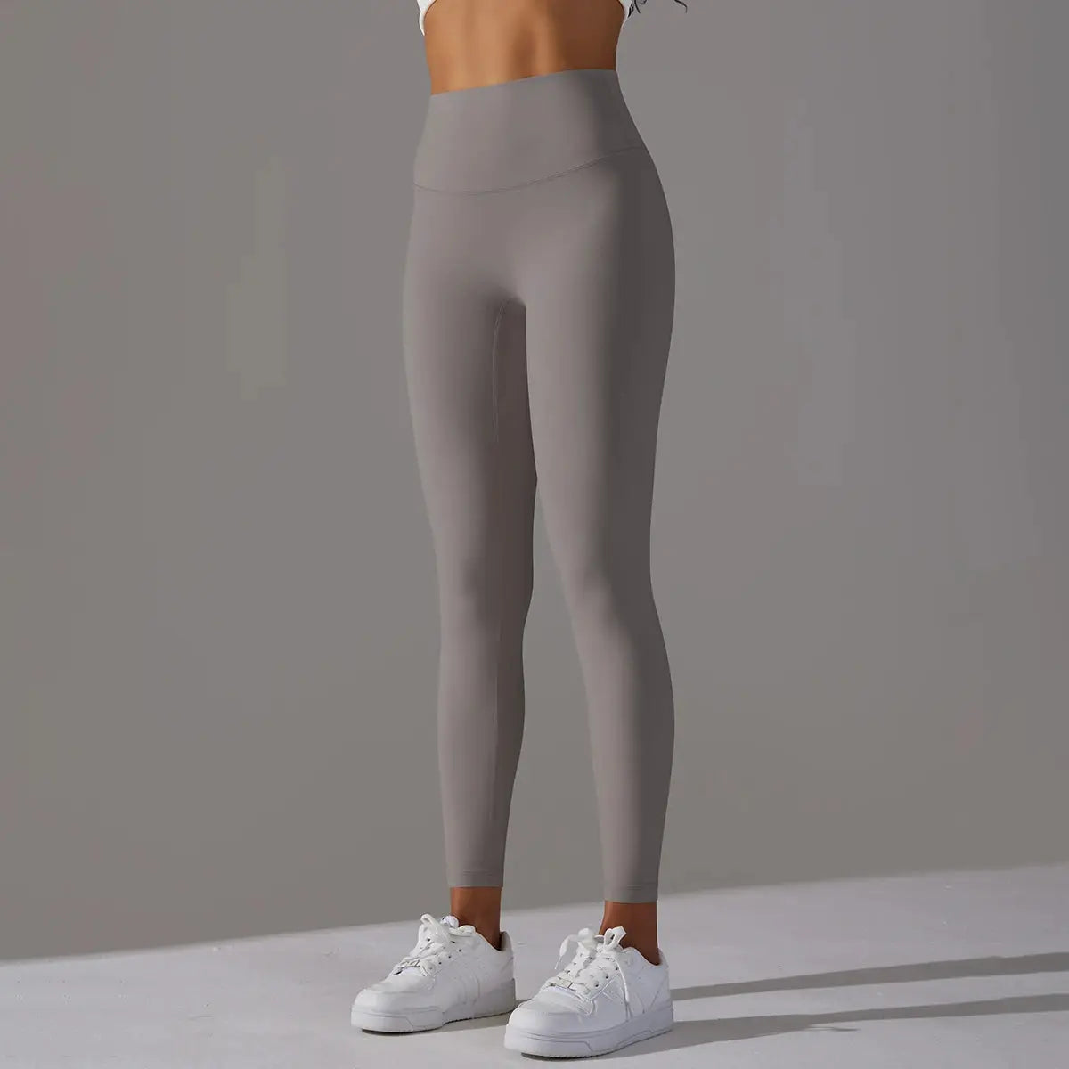 Women's high-waist leggings in taupe gray for fitness, running, and yoga