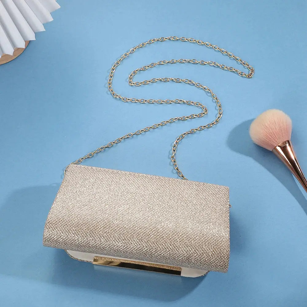Sequined evening bag with chain strap in champagne color by Simples Market