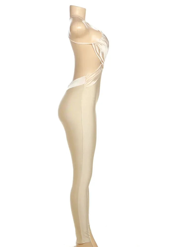 kliou Cross Pleated Backless Jumpsuit in silky beige, slim-fit one-piece for party wear; feminine silhouette