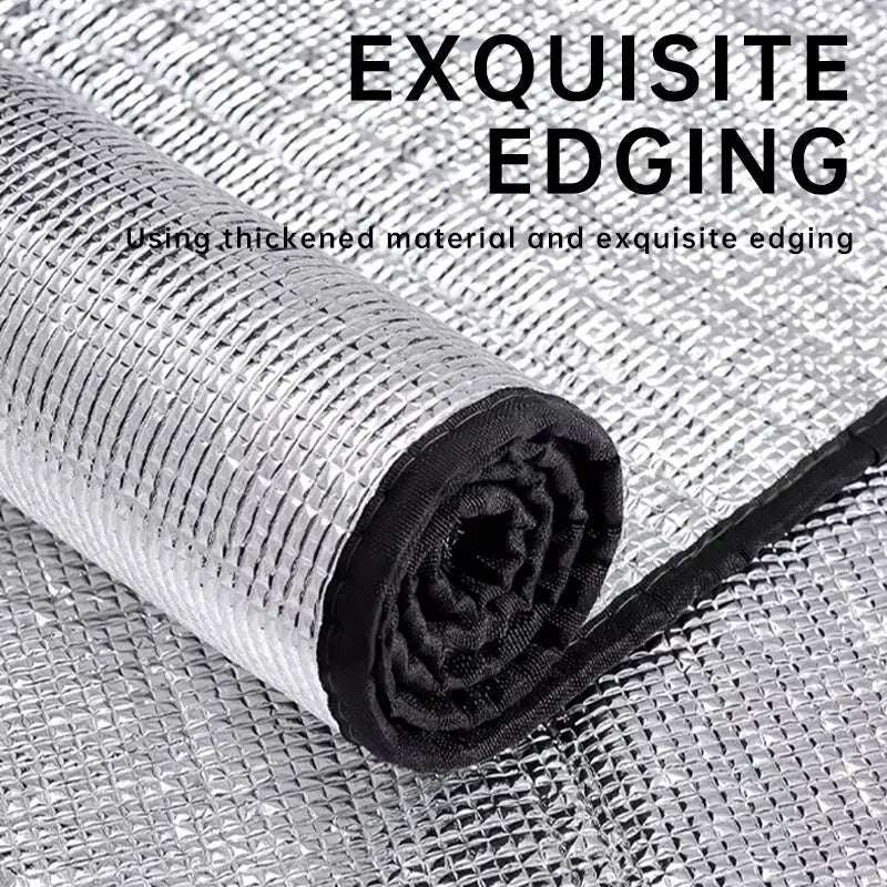Outdoor camping foil insulation mat rolled up; silver aluminum surface, moisture-proof sleeping pad