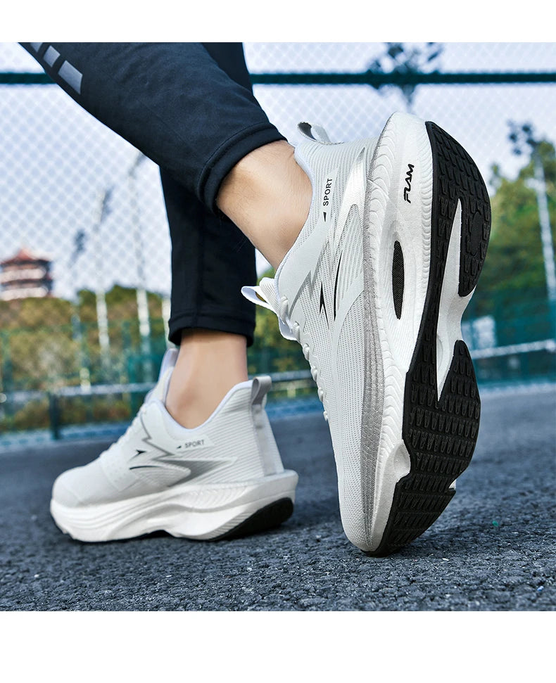 Pair of white running shoes with breathable mesh and black outsole