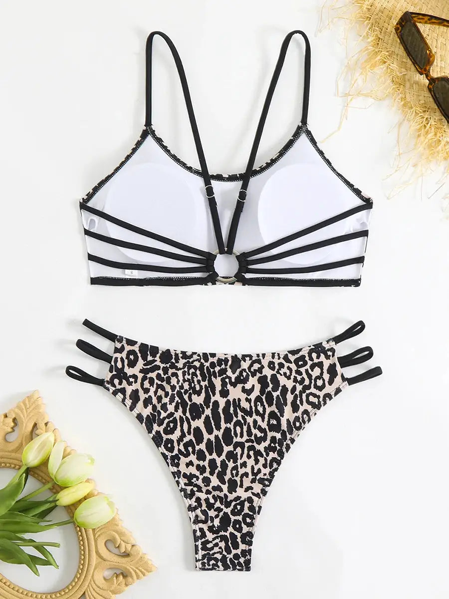 Strappy bikini set with white padded top and leopard-print bottoms, black side straps