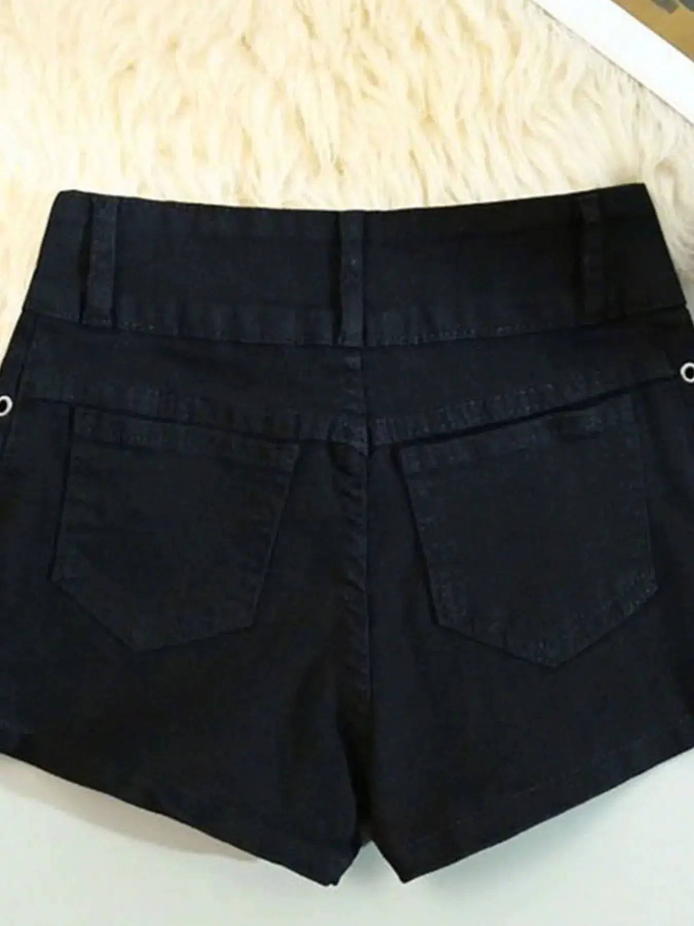 Women's black shorts by Simples Market with back pockets and belt loops