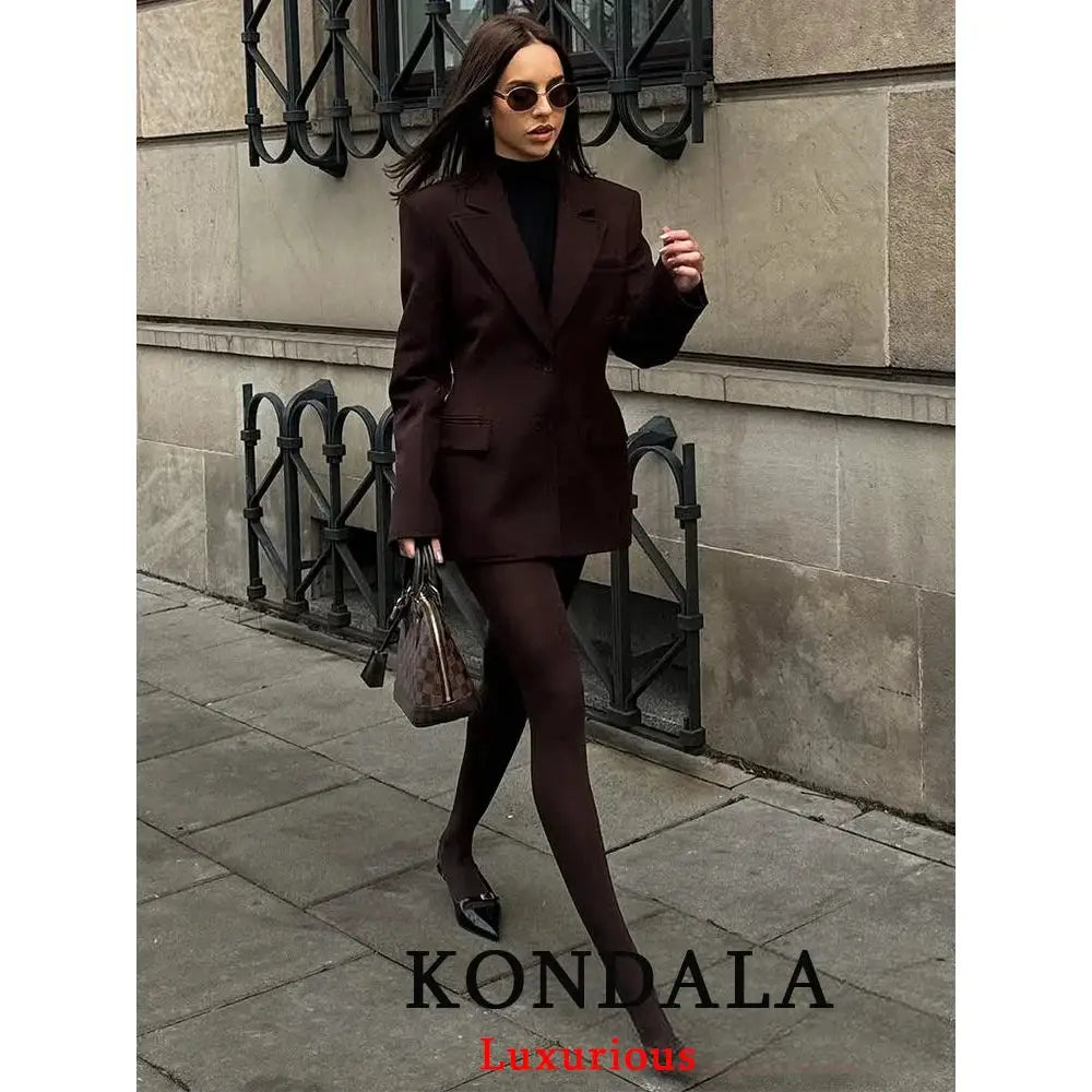 KONDALA brown blazer suit set with pockets and front buttons, shown with black turtleneck and tights