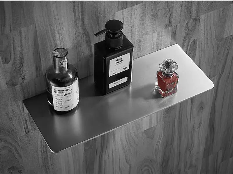 Simples Market 304 stainless steel bathroom corner shelf in brushed chrome with three bottles