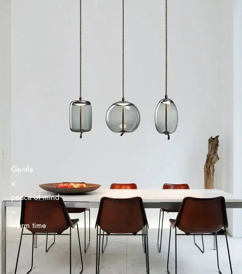 Simples Market minimalist pendant lamps set of 3 with blue glass shades and hemp rope cords over a dining table