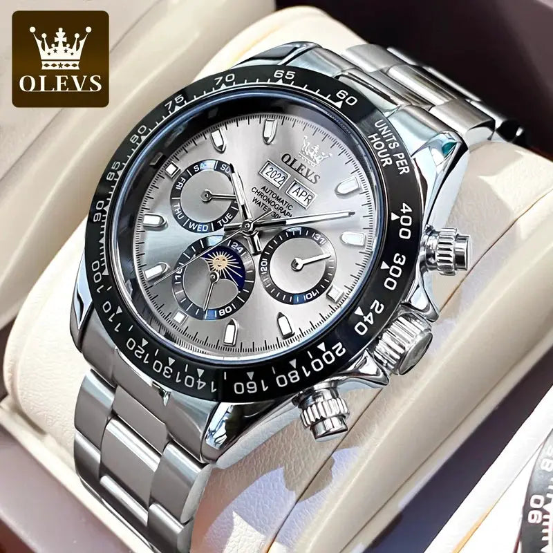 OLEVS men's stainless steel automatic watch with silver dial, chronograph subdials, date window, tachymeter bezel.