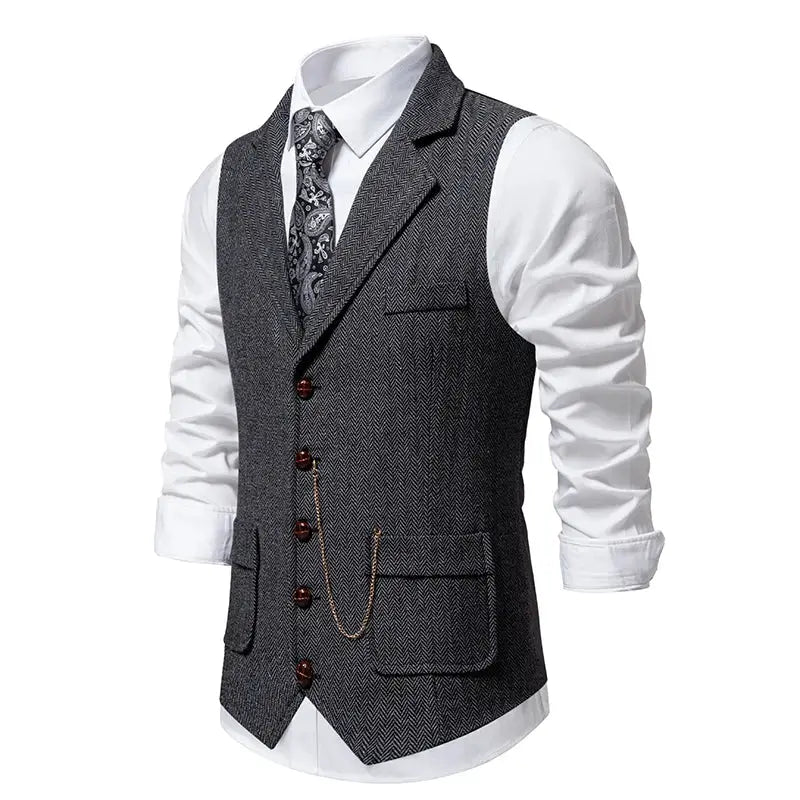 Men's tweed waistcoat with herringbone pattern, brown buttons and pocket watch chain over a white shirt
