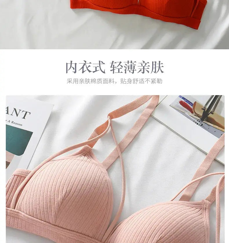 Two wireless bras: peach-pink bralette with adjustable straps and a partial orange bra on a white bed