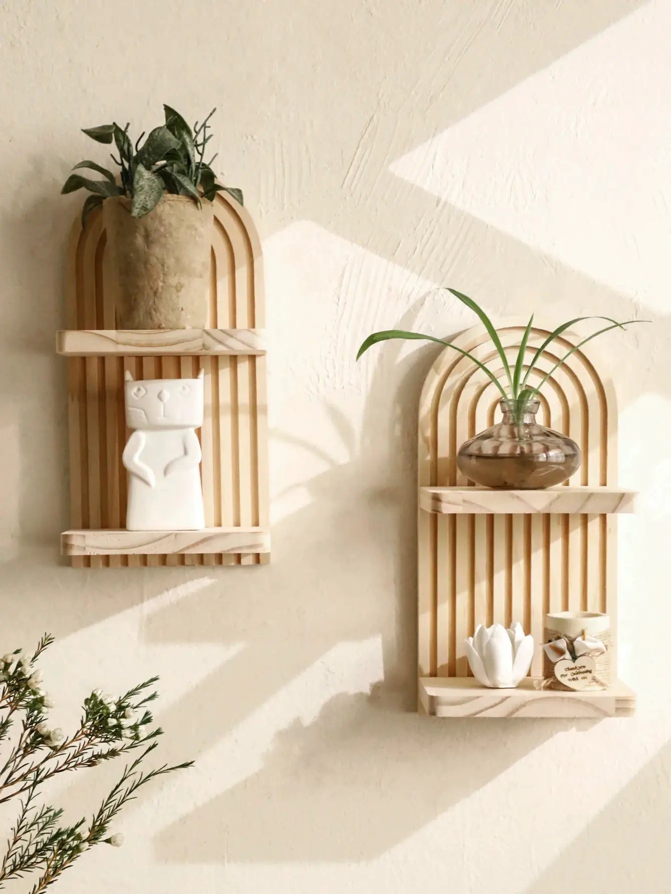 Two boho geometric wooden wall shelves in natural finish, wall-mounted with plants and decor