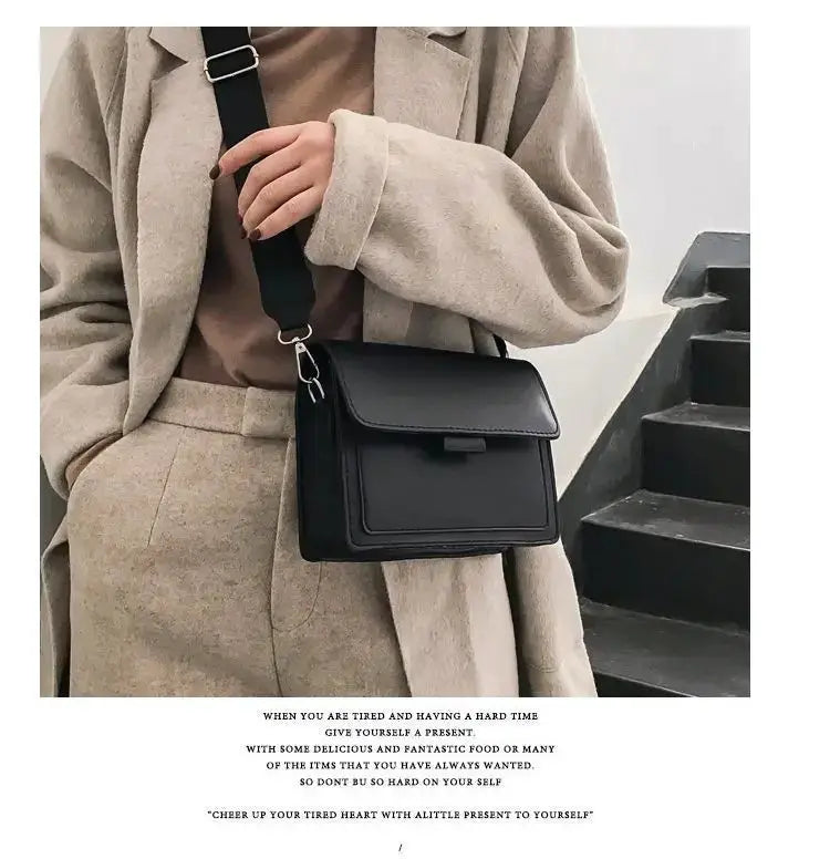 Crossbody bag in black PU leather with adjustable strap and front flap