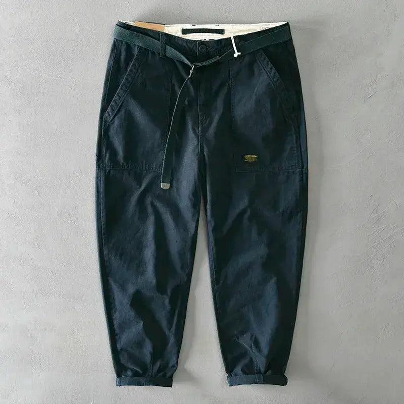 Dark navy men's 100% cotton casual pants with drawstring waist, front pockets, cuffed hems