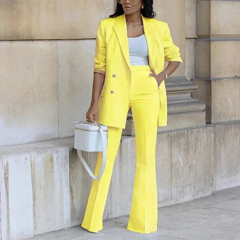 Yellow blazer and straight-leg pants two-piece suit with white top and white handbag