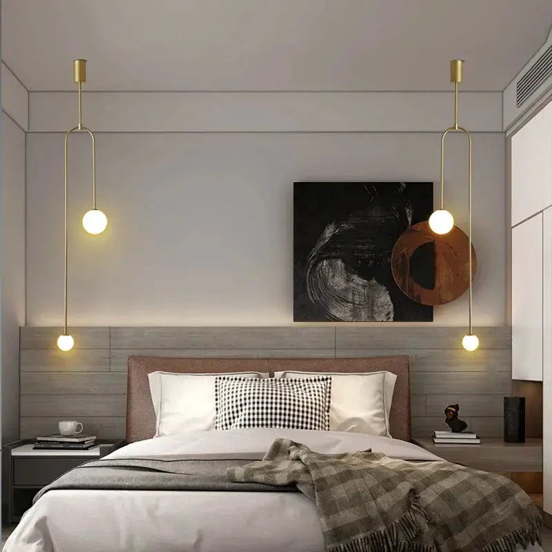Modern glass ball LED pendant lights in gold, two bedside hanging lamps by Simples Market