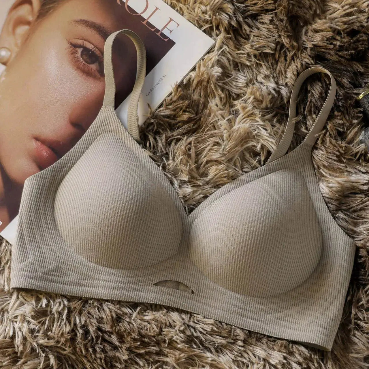 Beige seamless wireless bra with molded cups on a plush faux-fur rug
