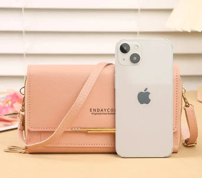 Women’s mid-size wallet bag in pink faux leather with coin pocket and convertible shoulder strap