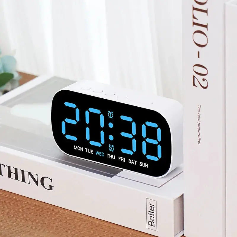 Digital alarm clock by Simples Market, white USB-powered with blue LED digits and weekday indicators