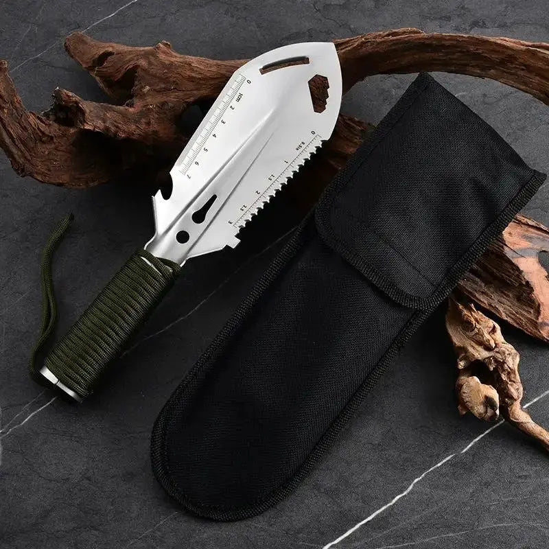 Portable stainless steel digging shovel with green-wrapped handle, ruler scale, and black sheath