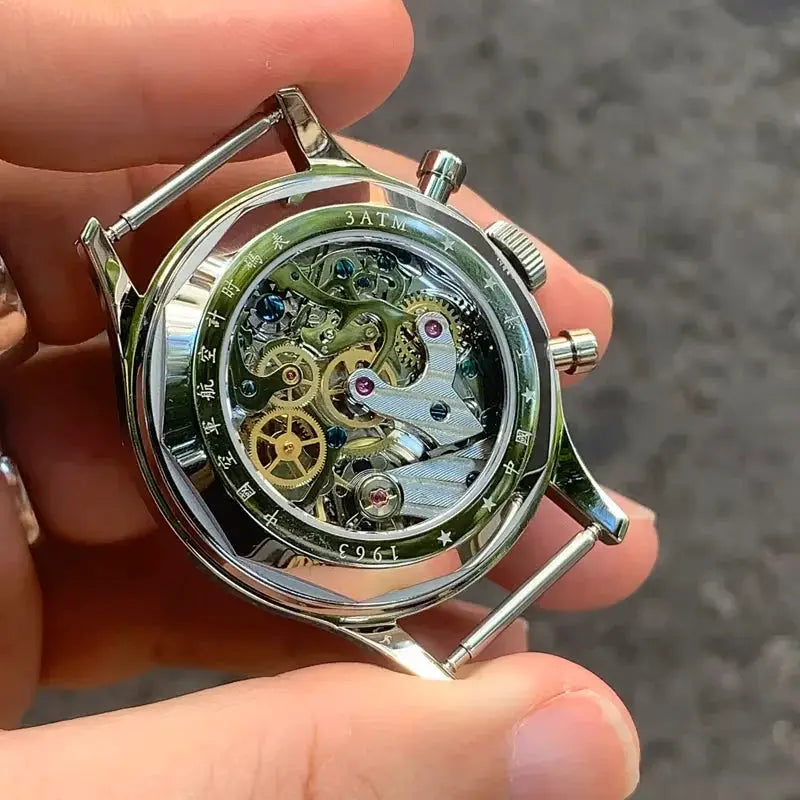 Seagull 1963 skeleton mechanical wristwatch with transparent case back and stainless steel case.