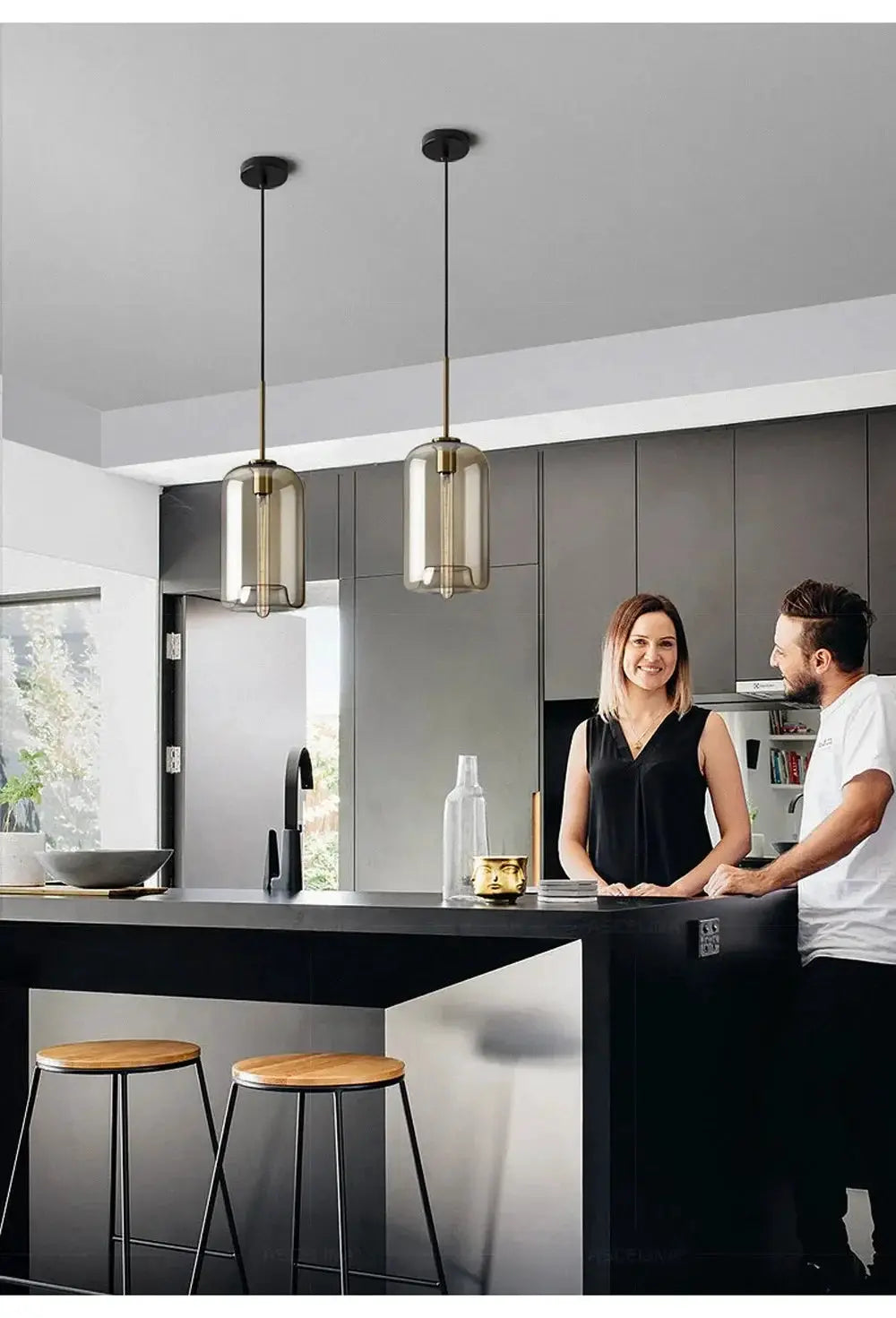 Nordic LED glass chandelier with twin amber pendant lights and brass accents over a modern kitchen island