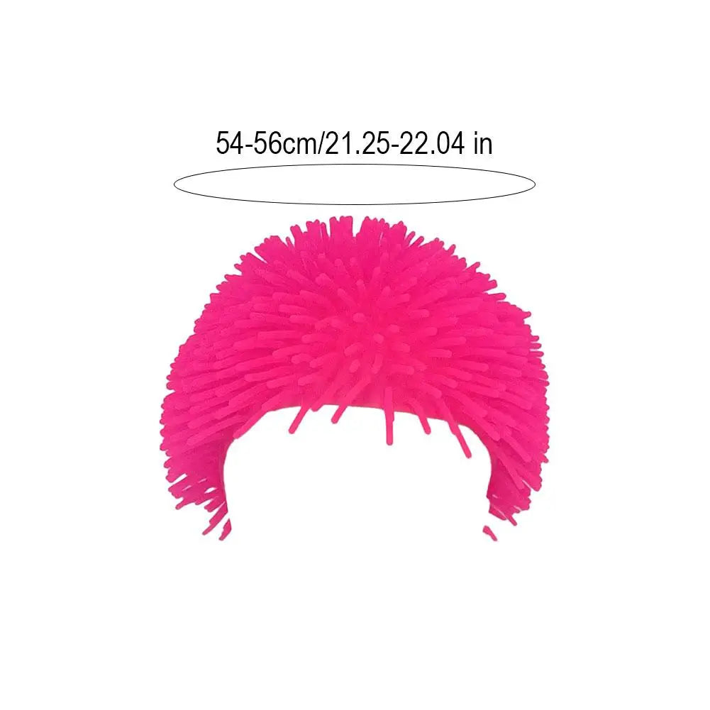 Spiky ball prank hat in pink; unisex, soft TPR wig-style headwear, size 54–56 cm.