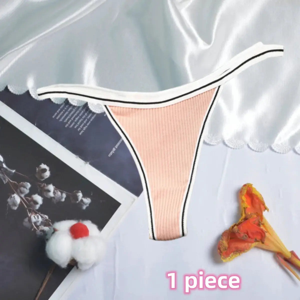 Women's cotton thong underwear in peach with ribbed front, low-rise fit, white waistband and black trim