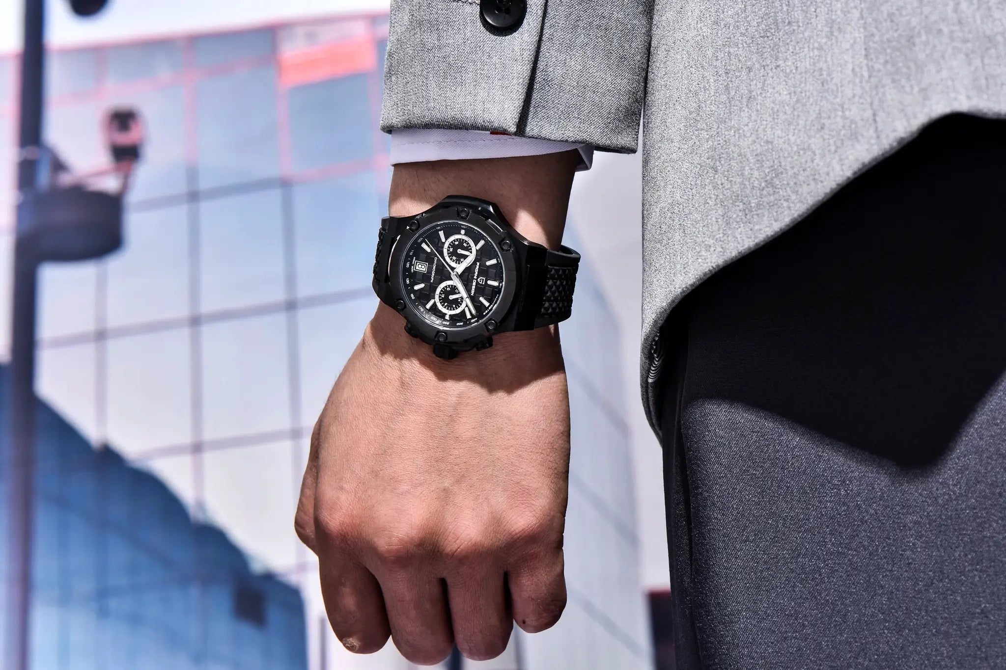 PAGANI DESIGN men's sport chronograph watch with black case and fluororubber strap on wrist